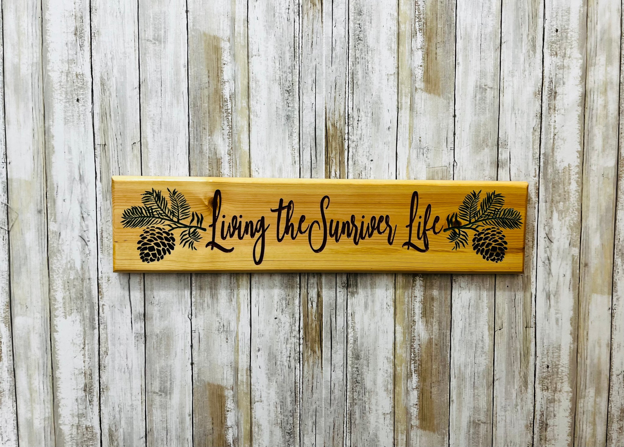 Living the Sunriver Life Colored Pine Cone Branch Sign - Carved Pine Wood
